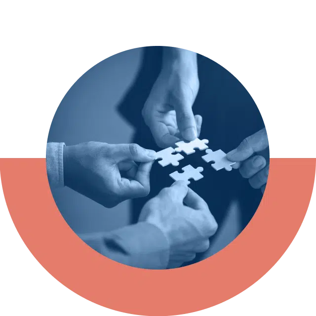 4 hands each holding puzzle pieces