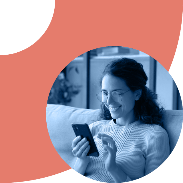 Woman looking at mobile phone smiling